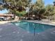 Community pool surrounded by mature trees is fenced for safety and offers a refreshing escape at 461 N Lamb Blvd # H, Las Vegas, NV 89110