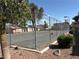 Community tennis court provides residents with recreational opportunities in a fenced outdoor area at 461 N Lamb Blvd # H, Las Vegas, NV 89110