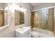 Bathroom features granite countertops, a vessel sink, a soaking tub, and a separate shower with glass doors at 472 Tiger Lily Way, Henderson, NV 89015
