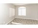 Bedroom showcasing neutral colored walls, tile floors, and windows that provide natural light at 472 Tiger Lily Way, Henderson, NV 89015