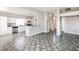 Open kitchen featuring stainless steel appliances, bar seating, and easy flow into living and dining areas at 472 Tiger Lily Way, Henderson, NV 89015