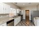 Well-lit kitchen featuring stainless steel appliances, granite countertops, and ample cabinet space at 472 Tiger Lily Way, Henderson, NV 89015