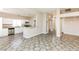 Open-concept living area featuring modern floors connecting the kitchen with granite countertops, to the main area with bright neutral colors at 472 Tiger Lily Way, Henderson, NV 89015