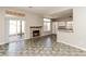Bright living room with a fireplace and access to a patio, seamlessly connecting indoor and outdoor spaces at 472 Tiger Lily Way, Henderson, NV 89015