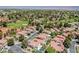 Aerial view showcasing neighborhood homes, green spaces, and a golf course at 5133 Burr Oak Dr, Las Vegas, NV 89130