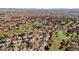 The aerial view shows a residential community and a golf course with a pond at 5133 Burr Oak Dr, Las Vegas, NV 89130