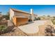 Backyard patio area with desert landscaping and storage shed at 5133 Burr Oak Dr, Las Vegas, NV 89130