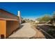Backyard patio area with desert landscaping and storage shed at 5133 Burr Oak Dr, Las Vegas, NV 89130