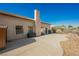 Backyard patio area with desert landscaping and open space at 5133 Burr Oak Dr, Las Vegas, NV 89130