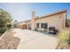 Large backyard patio with a built-in barbeque and rock landscaping at 5133 Burr Oak Dr, Las Vegas, NV 89130