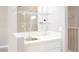 Features a sink, countertop, shelving, and stylish wall mirror at 5133 Burr Oak Dr, Las Vegas, NV 89130