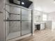 Bathroom featuring a shower with glass doors, vanity, and natural light at 5133 Burr Oak Dr, Las Vegas, NV 89130