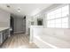 The bathroom features a soaking tub, a large window, and double vanity sinks at 5133 Burr Oak Dr, Las Vegas, NV 89130