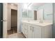Bathroom vanity with double sinks and a mirror, complemented by a storage room at 5133 Burr Oak Dr, Las Vegas, NV 89130
