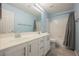 Bathroom featuring double sinks, shower-tub combo, and modern fixtures at 5133 Burr Oak Dr, Las Vegas, NV 89130