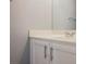 A close up of a bright bathroom vanity sink with cabinets and a mirror at 5133 Burr Oak Dr, Las Vegas, NV 89130