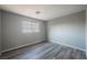 A bright bedroom featuring wood-look flooring and a window at 5133 Burr Oak Dr, Las Vegas, NV 89130