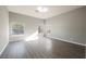 Spacious bedroom with natural light, featuring wood-look flooring and neutral walls at 5133 Burr Oak Dr, Las Vegas, NV 89130