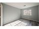A bright bedroom featuring wood-look flooring and a window at 5133 Burr Oak Dr, Las Vegas, NV 89130