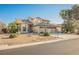 Two-story home featuring a two-car garage and desert landscaping at 5133 Burr Oak Dr, Las Vegas, NV 89130
