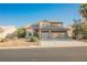 Two-story home featuring a two-car garage and desert landscaping at 5133 Burr Oak Dr, Las Vegas, NV 89130