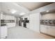 Modern kitchen featuring white cabinetry, stainless steel appliances, mosaic backsplash, and sleek countertops at 5133 Burr Oak Dr, Las Vegas, NV 89130
