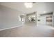 Expansive living room showcases modern flooring, neutral paint, and an open layout connecting to the kitchen for easy living at 5133 Burr Oak Dr, Las Vegas, NV 89130