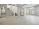Bright, open-concept living area with high ceilings, light floors, and staircase at 5133 Burr Oak Dr, Las Vegas, NV 89130