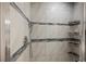 Modern tiled shower with built-in shelving and sleek fixtures at 5133 Burr Oak Dr, Las Vegas, NV 89130
