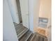 Staircase with wood-look flooring and white railings, leading to the lower level at 5133 Burr Oak Dr, Las Vegas, NV 89130