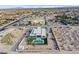 Modern home aerial shot, highlighting sleek architectural design and a private outdoor pool, set in a developing neighborhood at 5400 Mello Ave, Las Vegas, NV 89131