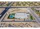Expansive aerial view shows a modern home featuring a pool, landscaping, and large yard at 5400 Mello Ave, Las Vegas, NV 89131