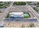 Aerial view showcases a modern home featuring a pool, lush backyard, and a spacious layout at 5400 Mello Ave, Las Vegas, NV 89131