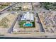 Aerial view of a property featuring a backyard pool, modern architecture, and spacious surroundings at 5400 Mello Ave, Las Vegas, NV 89131
