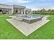 Beautiful backyard with a pool, spa, and lush green lawn at 5400 Mello Ave, Las Vegas, NV 89131
