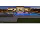 Stunning backyard pool area with modern lighting, an outdoor seating area and lush landscaping at 5400 Mello Ave, Las Vegas, NV 89131