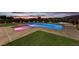 Stunning backyard features a pool, spa, and well-manicured lawn perfect for outdoor relaxation and recreation at 5400 Mello Ave, Las Vegas, NV 89131