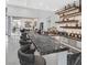 Home bar featuring counter seating and shelving with liquor displays at 5400 Mello Ave, Las Vegas, NV 89131