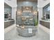 Luxurious bathroom with a freestanding tub, dual vanities, a walk-in shower and contemporary fixtures and finishes at 5400 Mello Ave, Las Vegas, NV 89131