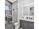 Modern bathroom features a glass-enclosed shower and stylish vanity with marble countertop at 5400 Mello Ave, Las Vegas, NV 89131