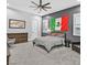 Modern bedroom featuring a ceiling fan, a Mexican flag, and minimalist decor at 5400 Mello Ave, Las Vegas, NV 89131