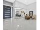 Spacious foyer with modern front door and office view through glass partition at 5400 Mello Ave, Las Vegas, NV 89131