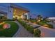 Beautiful modern home featuring manicured front yard with lighted walkways leading to a grand entrance at 5400 Mello Ave, Las Vegas, NV 89131