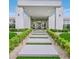 Inviting front entrance with landscaped walkway leading to the modern door at 5400 Mello Ave, Las Vegas, NV 89131