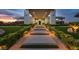 Stunning modern home featuring a grand entrance with lush landscaping, walkway lighting and contemporary design at 5400 Mello Ave, Las Vegas, NV 89131