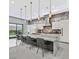 Modern kitchen with a large island, seating, and stainless steel appliances at 5400 Mello Ave, Las Vegas, NV 89131