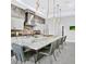Modern kitchen featuring an oversized island with barstool seating and unique countertops at 5400 Mello Ave, Las Vegas, NV 89131