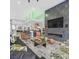 Contemporary living room featuring fireplace, large screen TV, and modern furniture at 5400 Mello Ave, Las Vegas, NV 89131