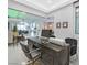 Home office with a dark wooden desk and views of the living area at 5400 Mello Ave, Las Vegas, NV 89131