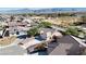 Aerial view of the community, highlighting a well-maintained home with a three-car driveway at 5480 Lincolnwood Ct, Pahrump, NV 89061
